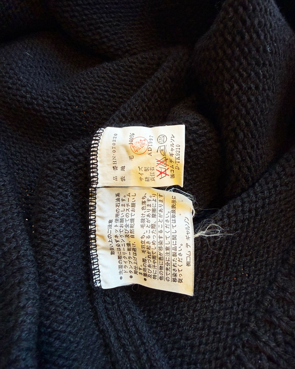 Textured Sweater with Curved Hem